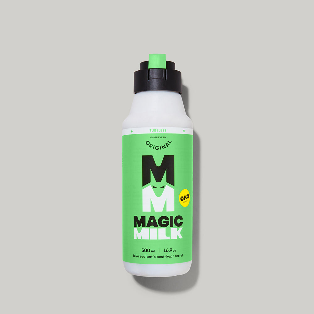 Magic Milk Tubeless Original sealant bottle — studio product photography