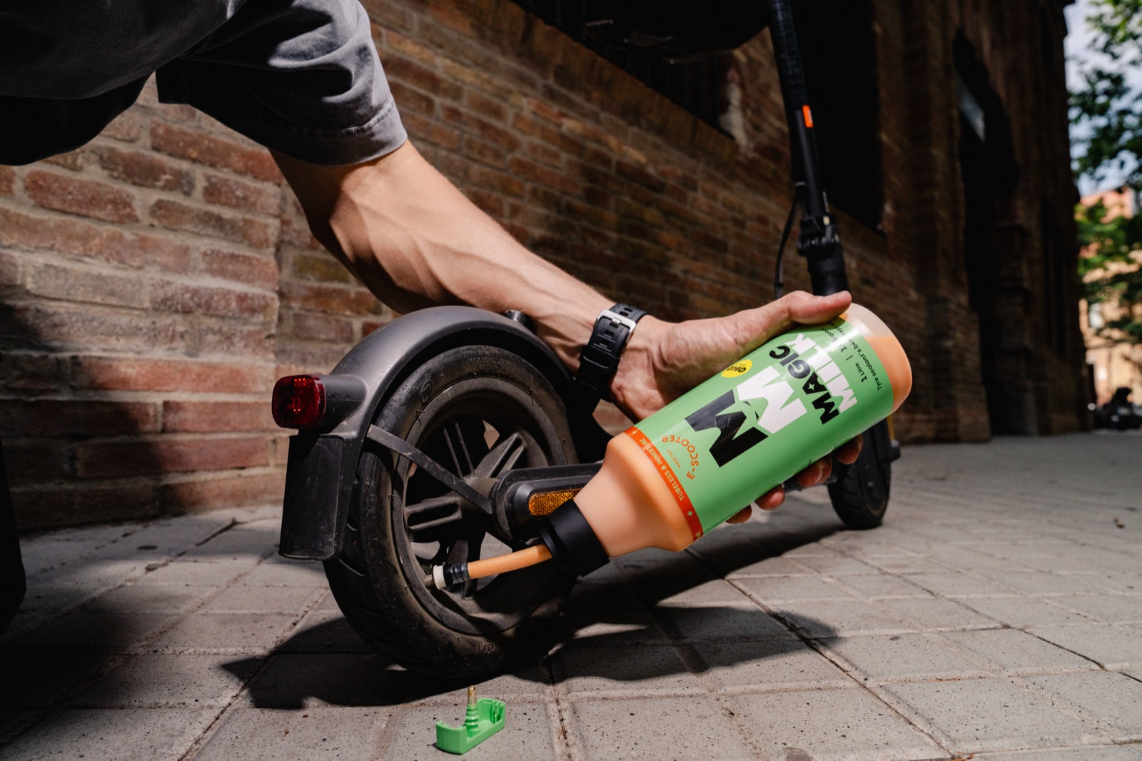 Magic Milk e-Scooter sealant being applied to an e-scooter tyre