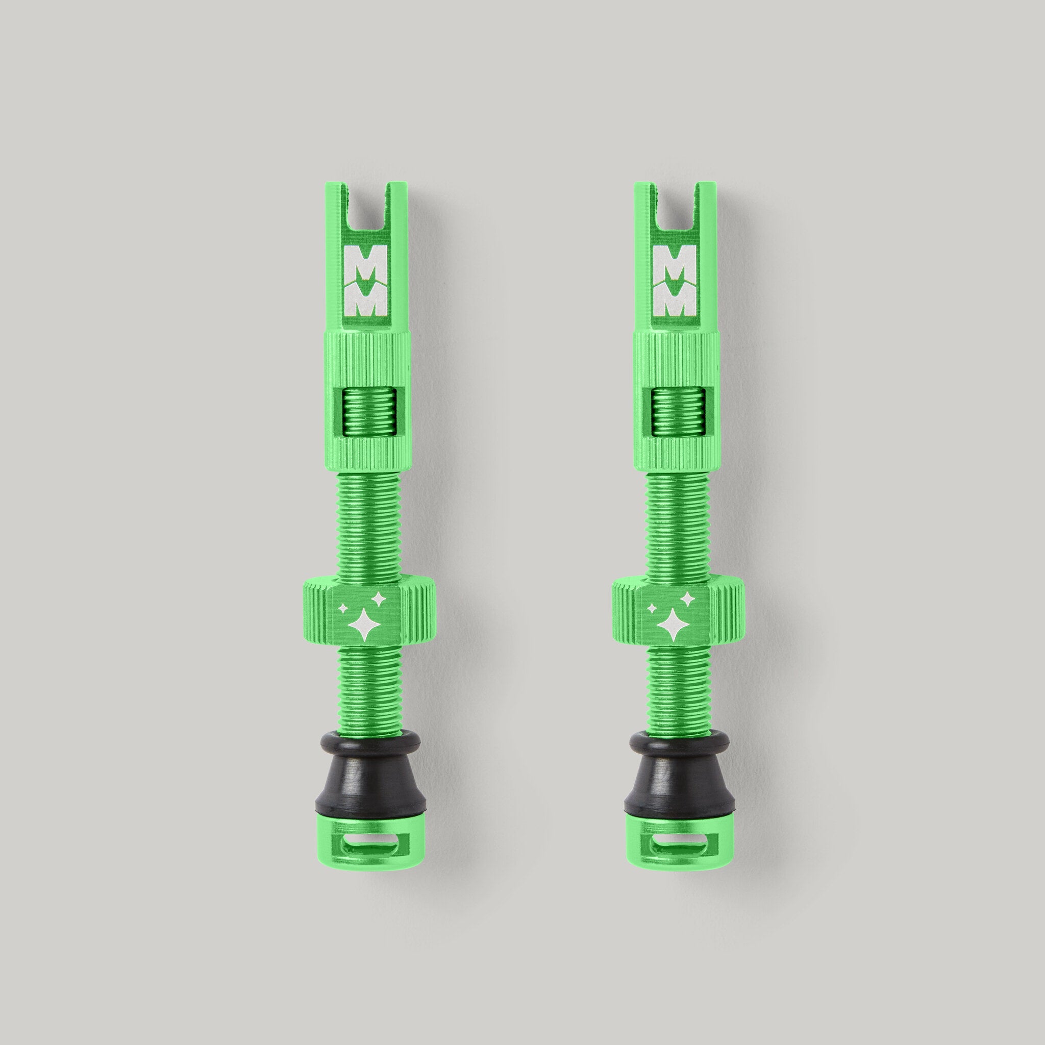 Magic Milk Tubeless Valves — pair, anodised green