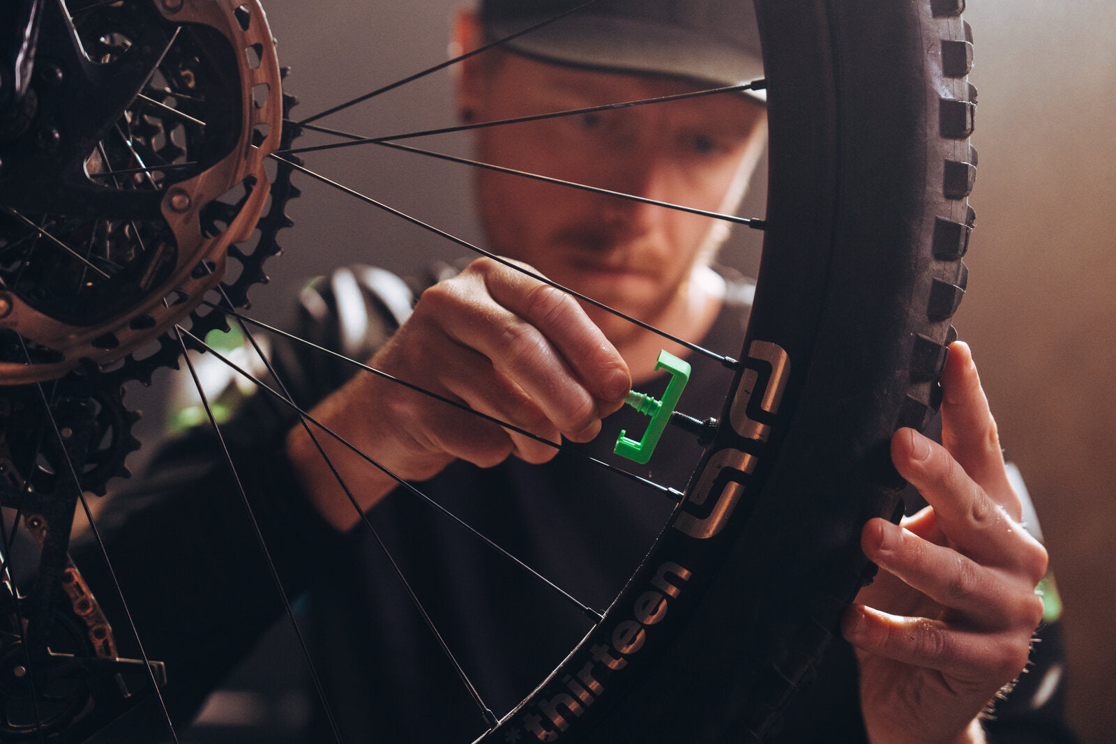 Mechanic setting up a tubeless mountain bike wheel