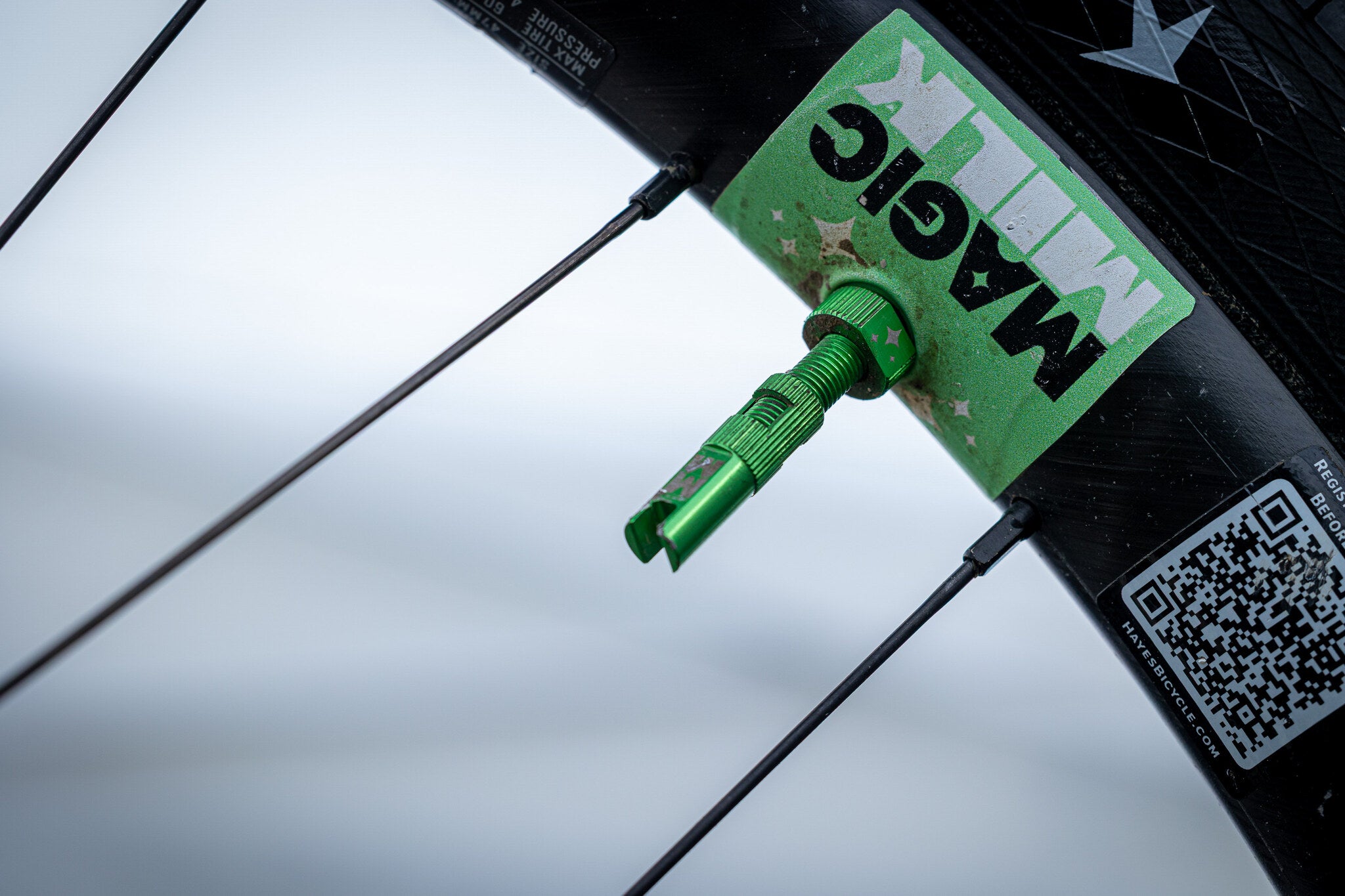 Magic Milk Tubeless Valve installed on a race wheel — AON Racing